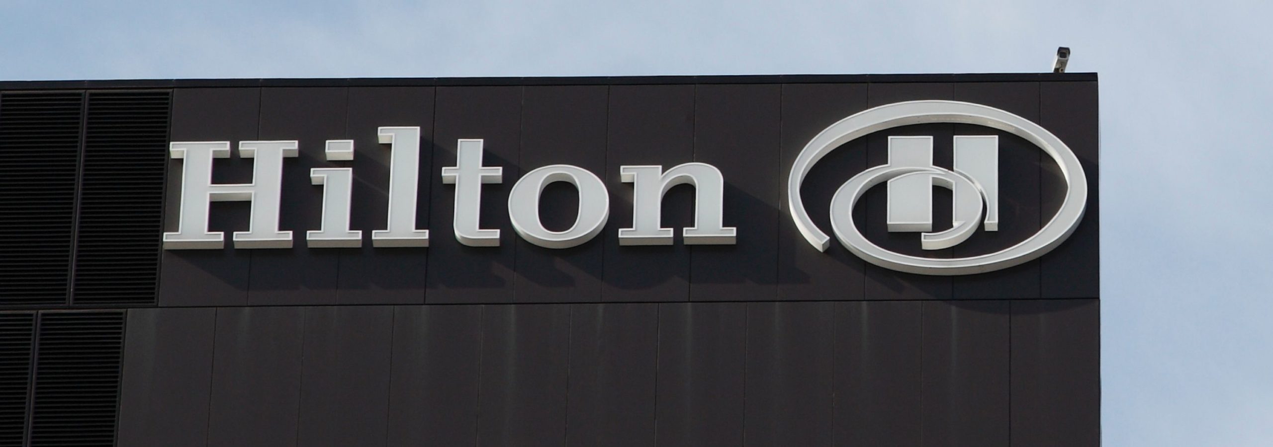 Hilton sign on a hotel building, illustrating the Hilton case study