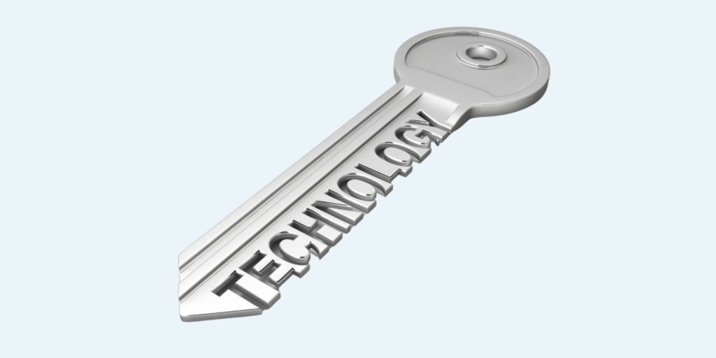 A key engraved with the word technology, illustrating technology as the key to talent retention