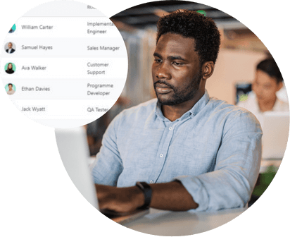 Employee at a laptop beside a list of key roles such as Sales Manager and QA Tester