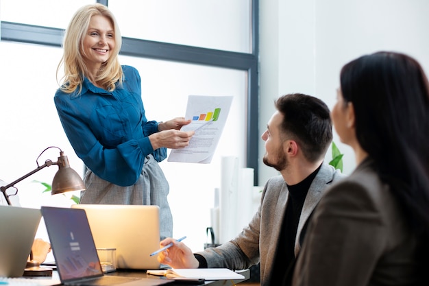 A Senior Employee Guiding Juniors to a Task